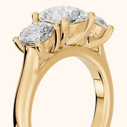 Callie Three-Stone Trellis Cushion Diamond Ring in Yellow Gold - slant-view.webp