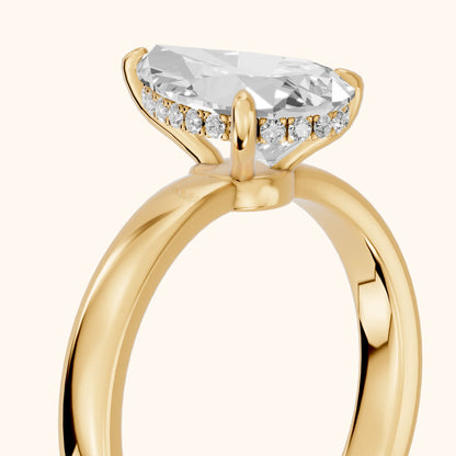 Lara Hidden Halo Pear Diamond Engagement Ring in Yellow Gold - slant-view.webp