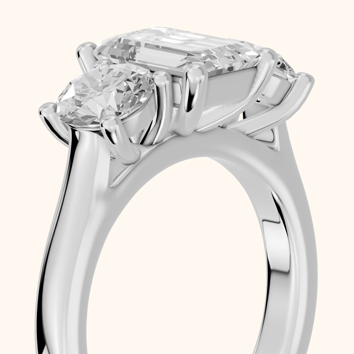 Callie Three-Stone Trellis Emerald Diamond Ring in Platinum - slant-view.webp