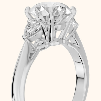 Libby Pear-Side Three-Stone Round Diamond Engagement Ring in Platinum - slant-view.webp