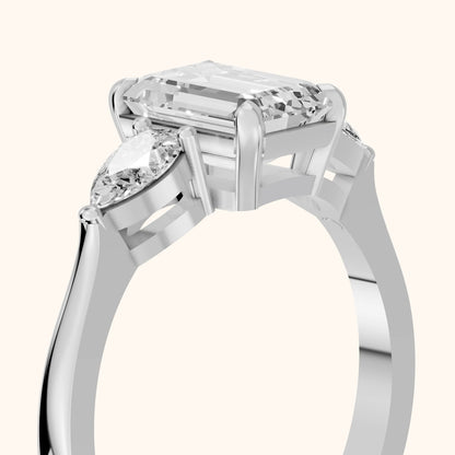 Grace Three Stone Emerald Diamond Engagement Ring in Platinum - slant-view.webp