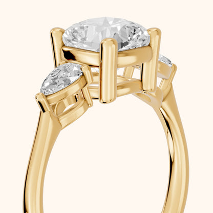 Faye Three-Stone Trellis Cushion Diamond Ring in Yellow Gold - slant-view.webp