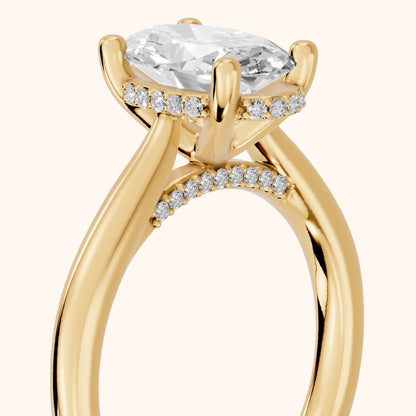 Hyacinth Hidden Halo Cathedral Oval Diamond Engagement Ring in Yellow Gold - slant-view.webp