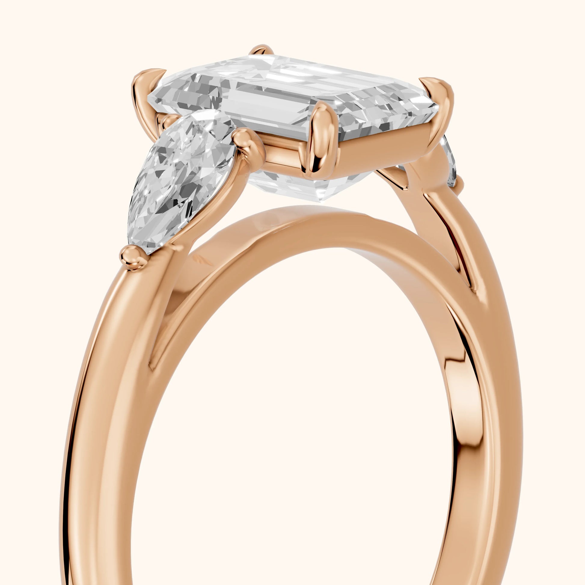 Phoebe Three-Stone Emerald Diamond Ring in Rose Gold - slant-view.webp