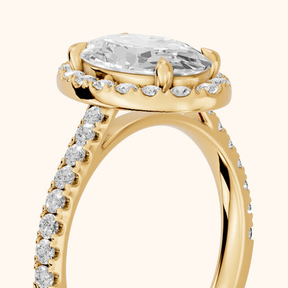 Amara Halo Claw Prong Oval Diamond Ring in Yellow Gold - slant-view.webp