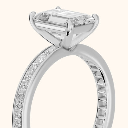 Brielle Channel Set Solitaire Emerald Diamond Ring in Platinum - slant-view.webp
