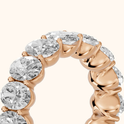 Flavia Shared Prong Oval Diamond Eternity Band in Rose Gold - slant-view