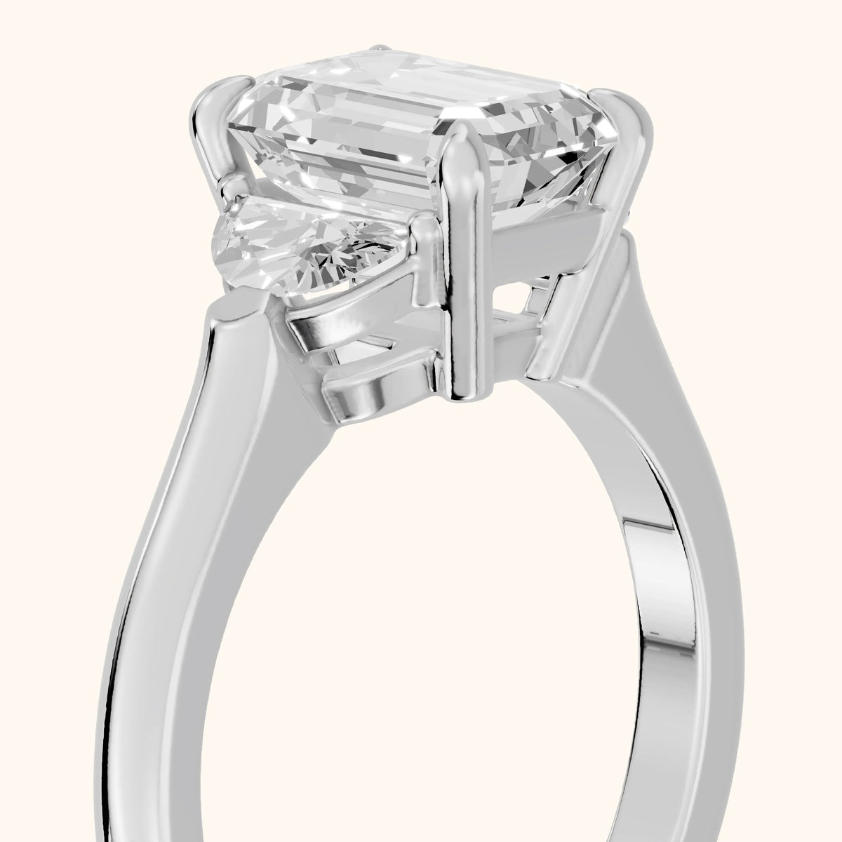 Elia Half-Moon Three-Stone Emerald Diamond Engagement Ring in Platinum - slant-view.webp
