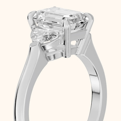 Elia Half-Moon Three-Stone Emerald Diamond Engagement Ring in Platinum - slant-view.webp