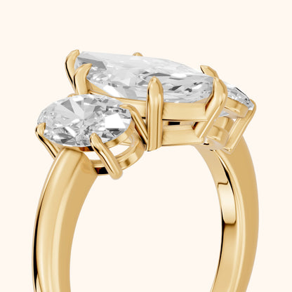 Lila Three-Stone Marquise Diamond Ring in Yellow Gold - slant-view.webp