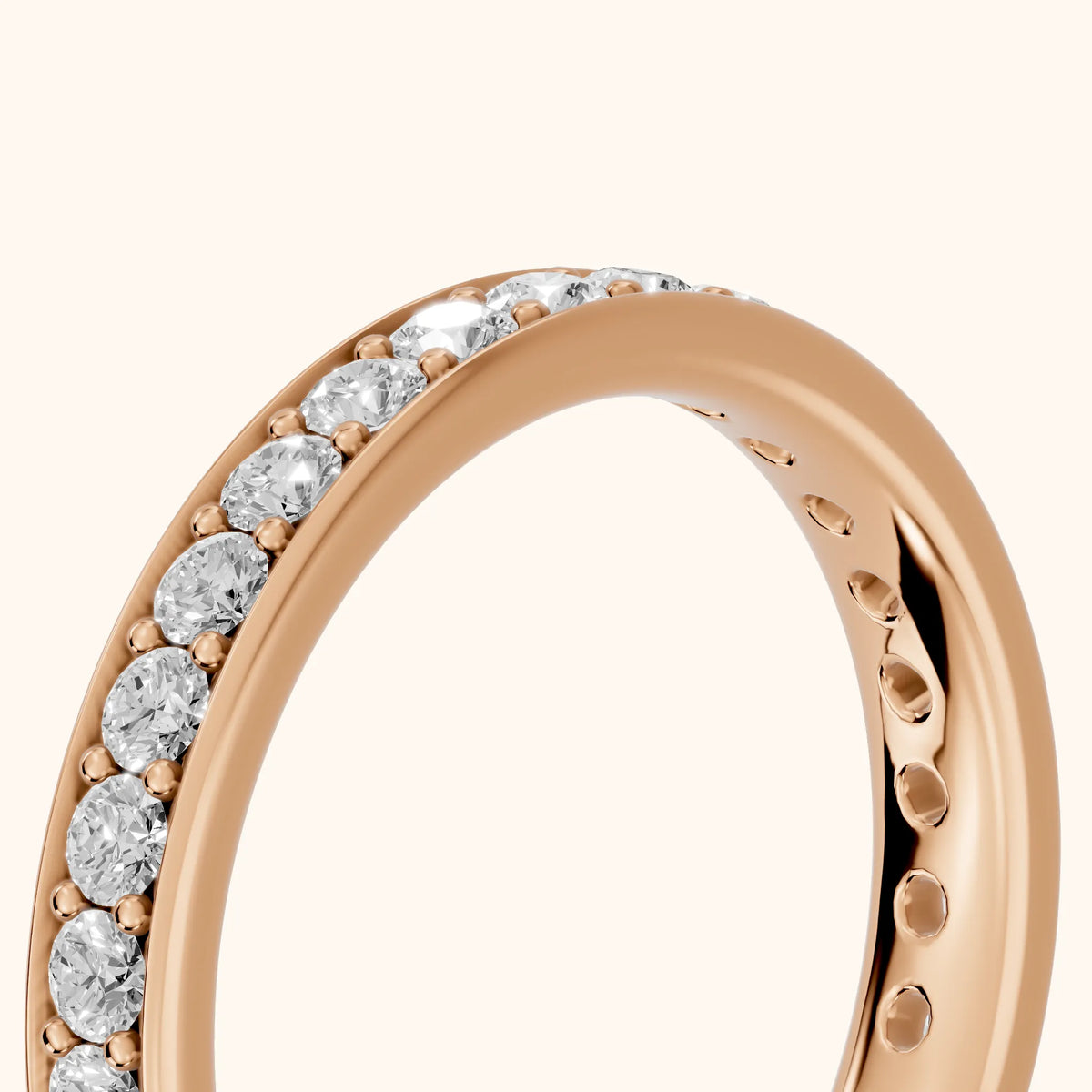 Constance Channel Set Round Diamond Eternity Band in Rose Gold - slant-view