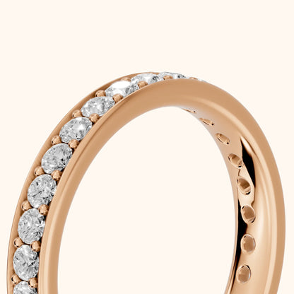 Constance Channel Set Round Diamond Eternity Band in Rose Gold - slant-view