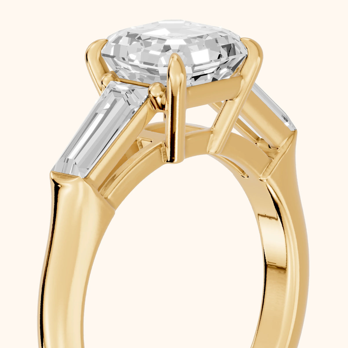 Davina Baguette Three-Stone Asscher Diamond Engagement Ring in Yellow Gold - slant-view.webp