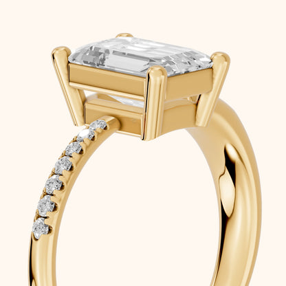Rosie Solitaire Basket Emerald Diamond Engagement Ring in Yellow Gold - slant-view.webp