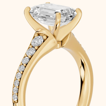 Calista Graduated Pavé Emerald Diamond Engagement Ring in Yellow Gold - slant-view.webp