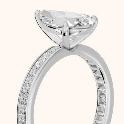 Brielle Channel Set Solitaire Pear Diamond Ring in Silver - slant-view.webp