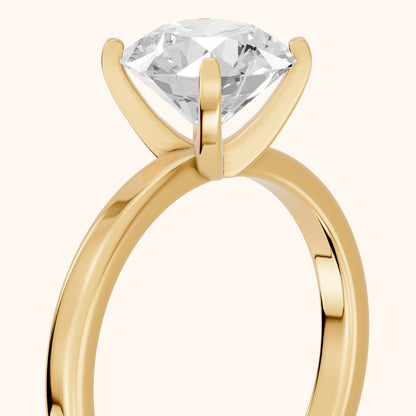 Liana Solitaire Claw Prong Round Diamond Engagement Ring in Yellow Gold - slant-view.webp