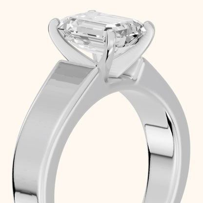 Susannah Wide Band Solitaire Emerald Diamond Engagement Ring in Silver - slant-view.webp