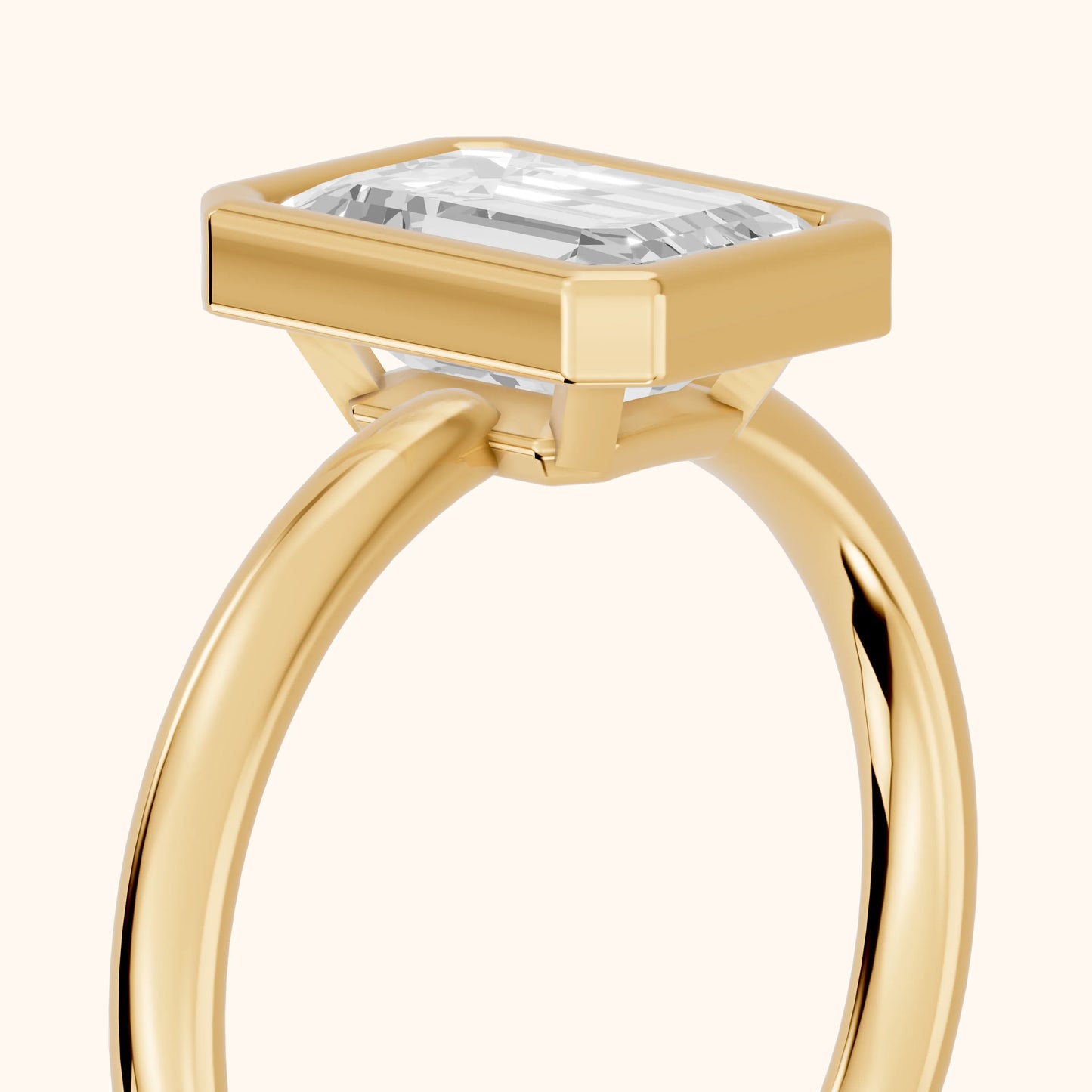 Maeve Bezel Solitaire Emerald Diamond Ring in Yellow Gold - slant-view.webp