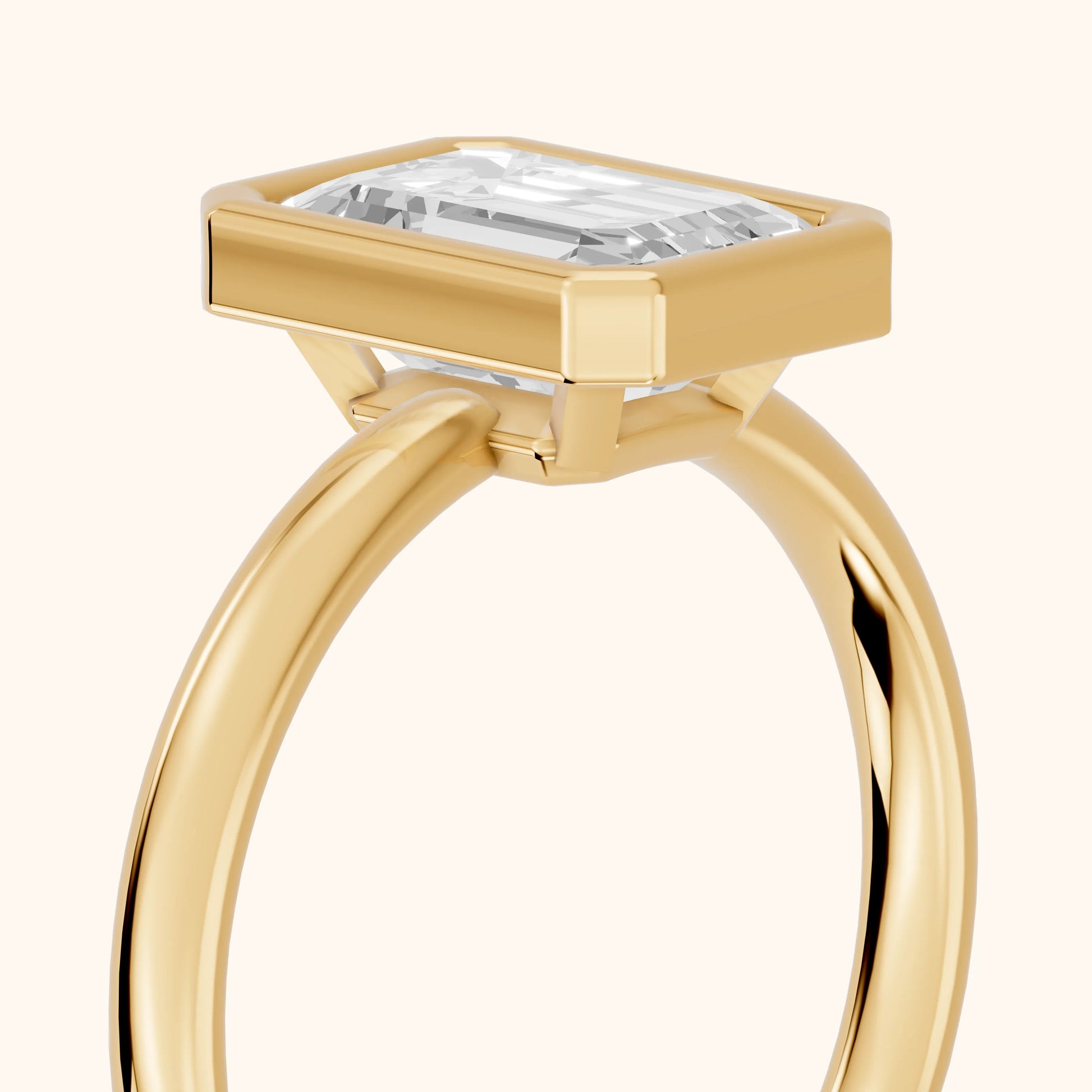 Maeve Bezel Solitaire Emerald Diamond Ring in Yellow Gold - slant-view.webp