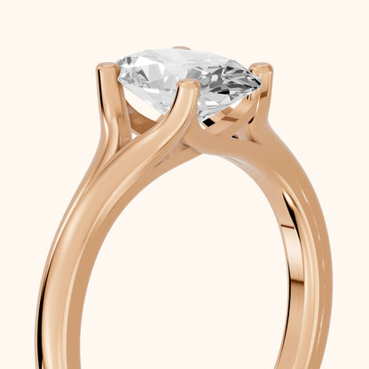 Nell Split Shank Solitaire Oval Diamond Engagement Ring in Rose Gold - slant-view.webp