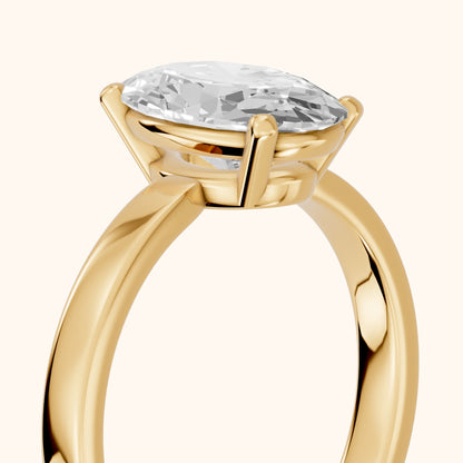 Delia Solitaire Oval Diamond Engagement Ring in Yellow Gold - slant-view.webp