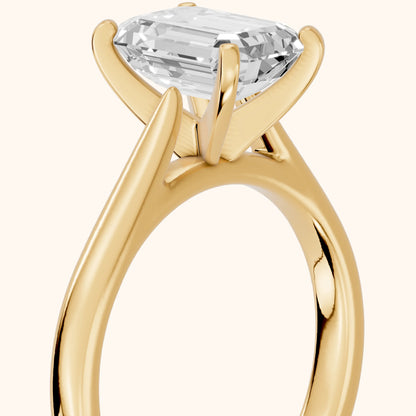 Enid Solitaire Cathedral Emerald Diamond Engagement Ring in Yellow Gold - slant-view.webp