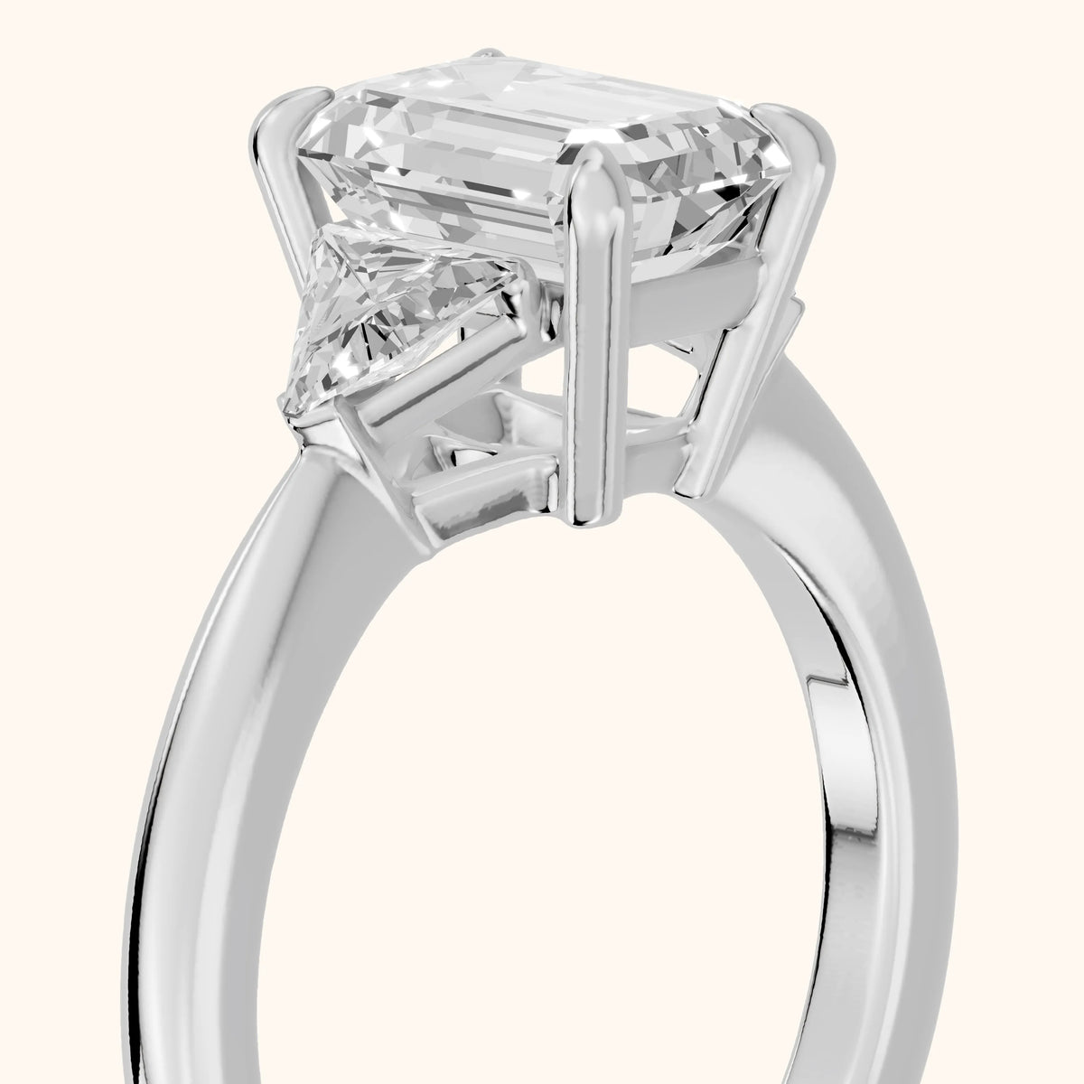 Clemency Three-Stone Cathedral Emerald Diamond Engagement Ring in Platinum - slant-view.webp
