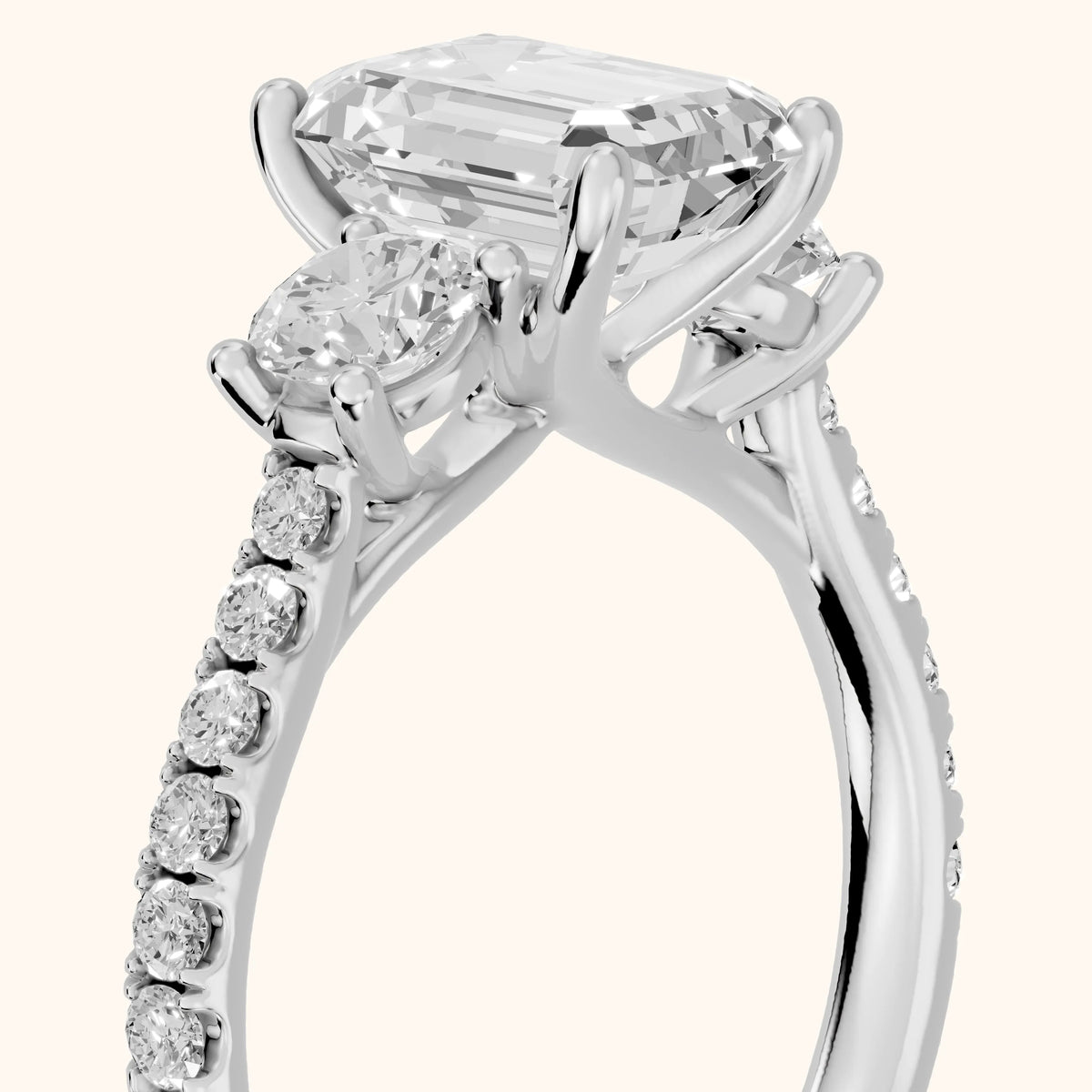 Sibyl Trellis Three-Stone Emerald Diamond Engagement Ring in Platinum - slant-view.webp