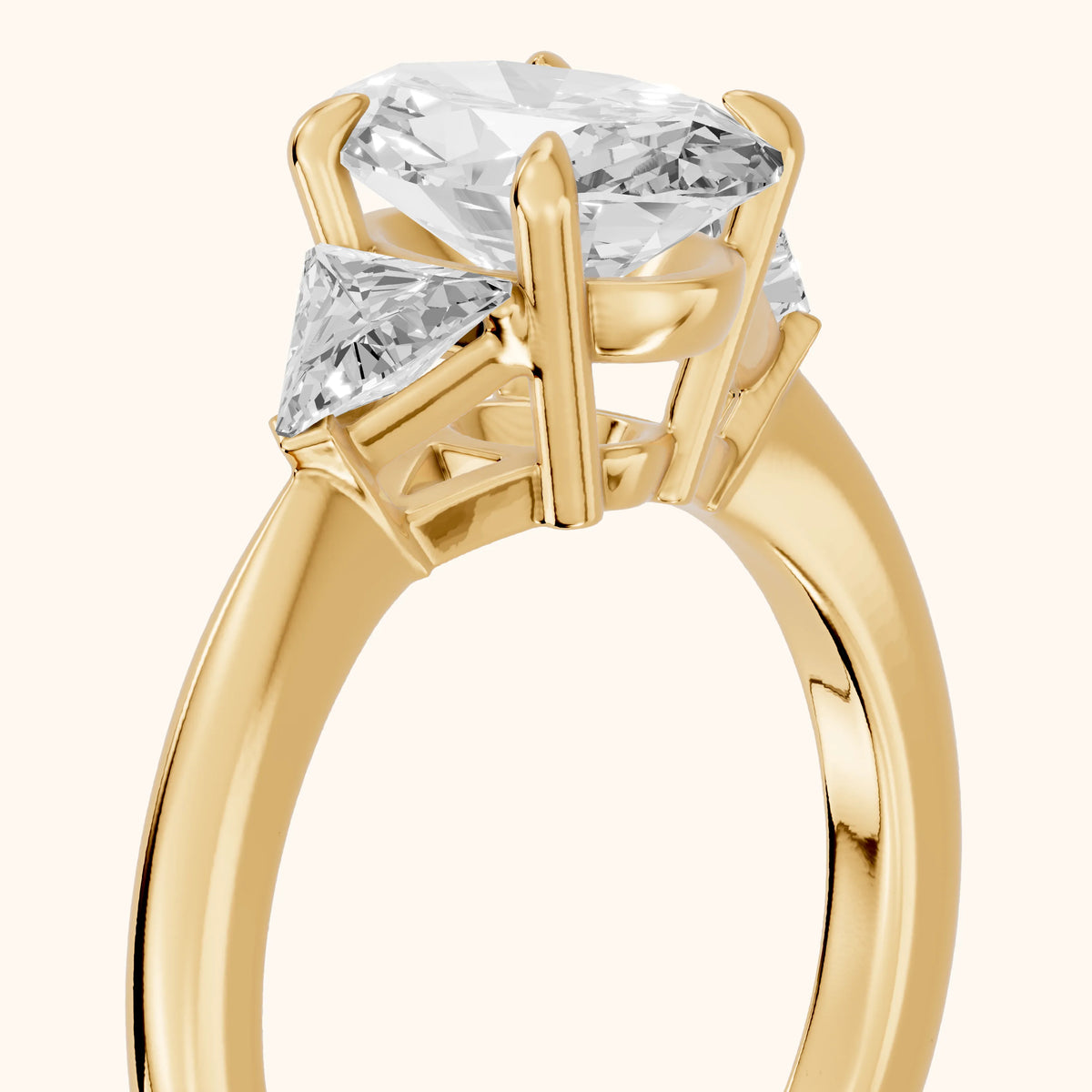 Clemency Three-Stone Cathedral Oval Diamond Engagement Ring in Yellow Gold - slant-view.webp