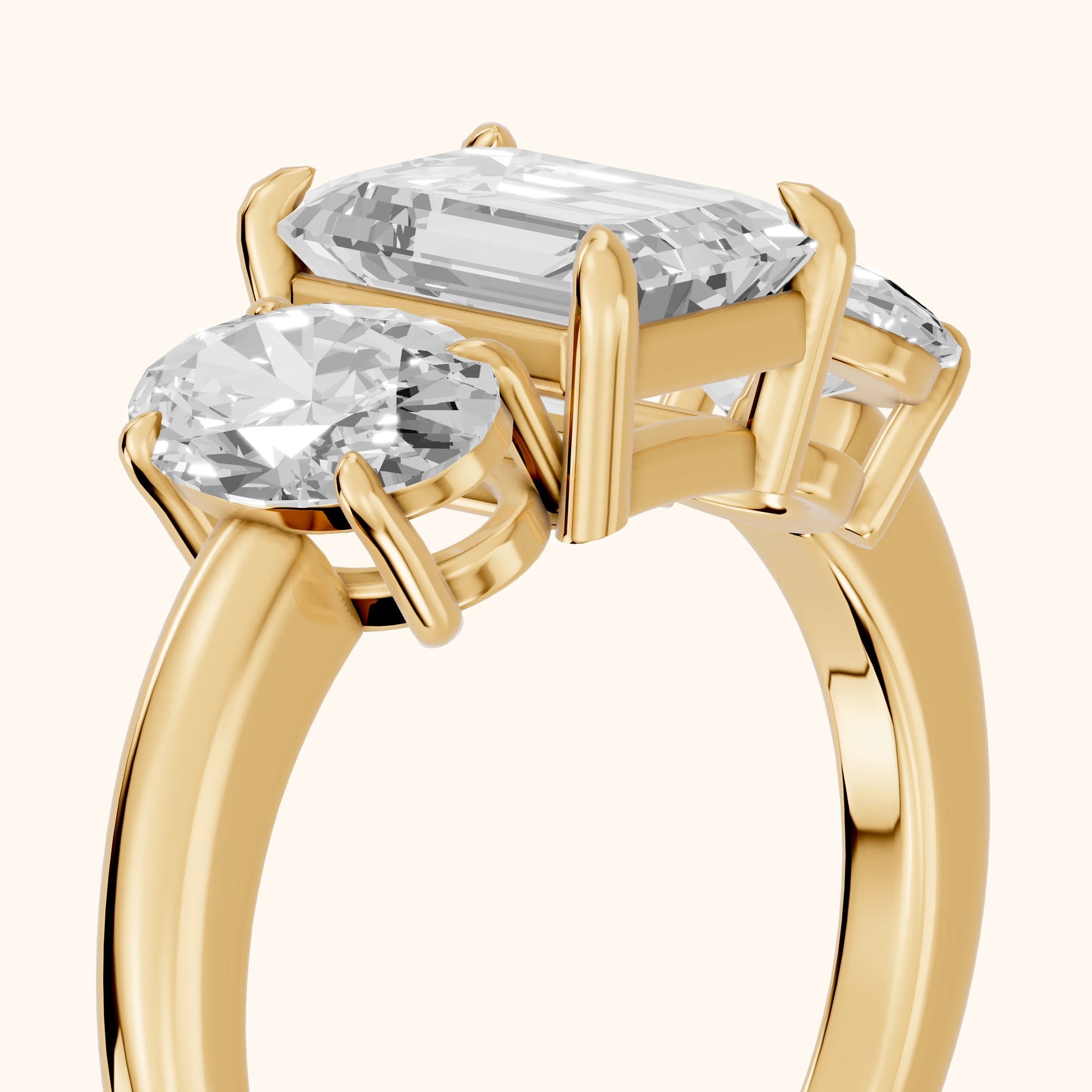 Lila Three-Stone Emerald Diamond Ring in Yellow Gold - slant-view.webp