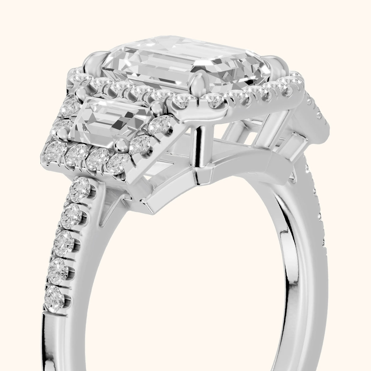 Paulina Three-Stone Halo Emerald Diamond Engagement Ring in Silver - slant-view.webp