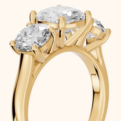 Esme Three-Stone Tapered Cushion Diamond Ring in Yellow Gold - slant-view.webp