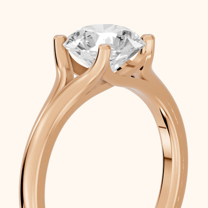Nell Split Shank Solitaire Round Diamond Engagement Ring in Rose Gold - slant-view.webp