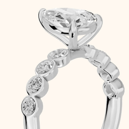 Edie Beaded Bezel Pear Diamond Engagement Ring in Platinum - slant-view.webp