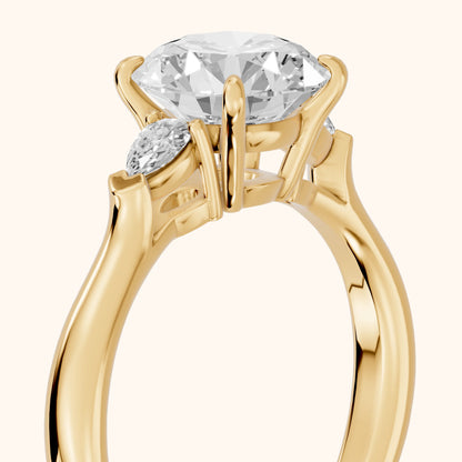Dahlia Three-Stone Cathedral Round Diamond Engagement Ring in Yellow Gold - slant-view.webp