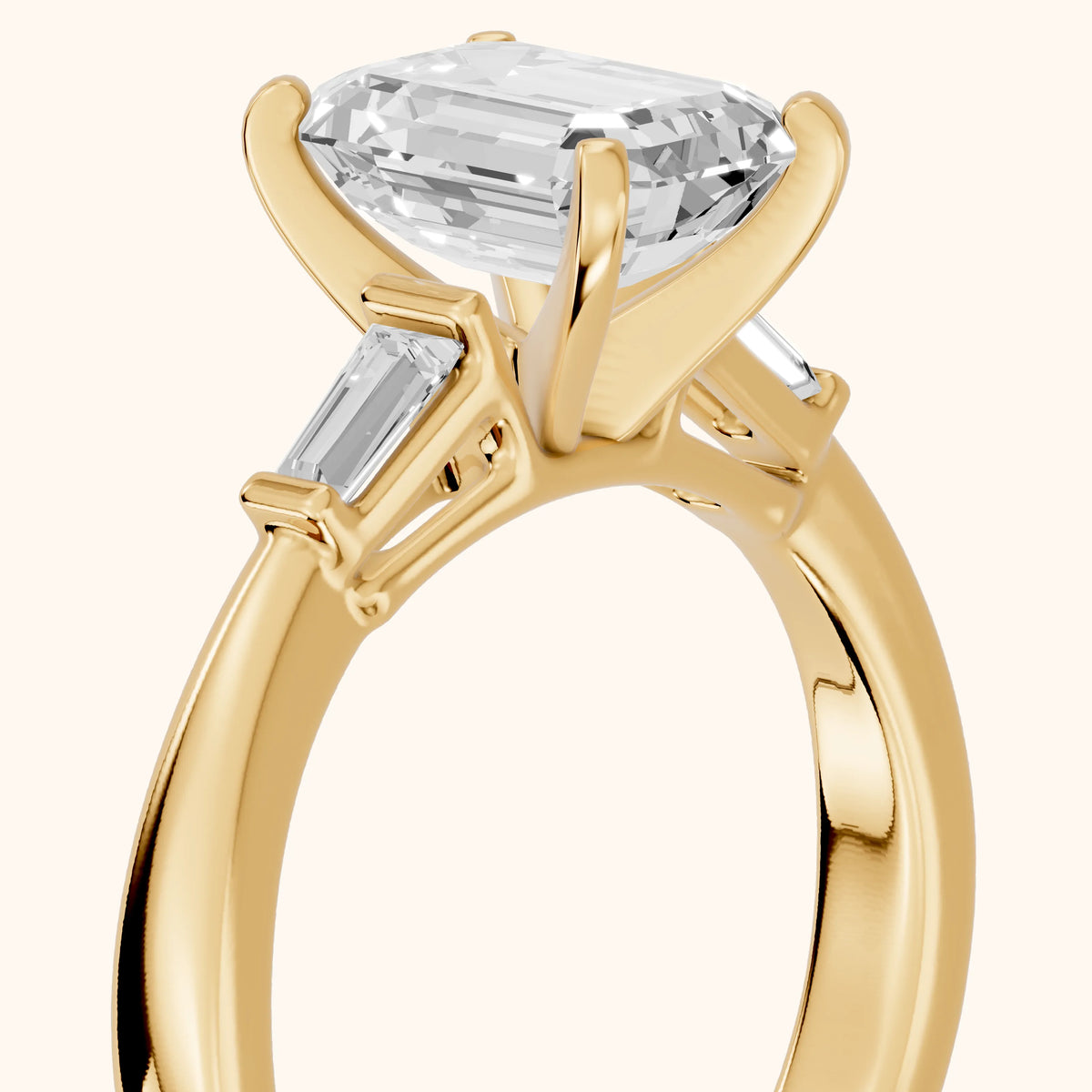 Jacinta Baguette Three-Stone Emerald Diamond Engagement Ring in Yellow Gold - slant-view.webp