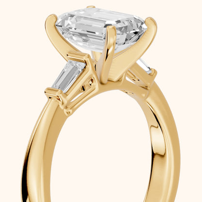 Jacinta Baguette Three-Stone Emerald Diamond Engagement Ring in Yellow Gold - slant-view.webp