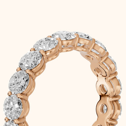 Dara Shared Prong Round Diamond Eternity Band in Rose Gold - slant-view