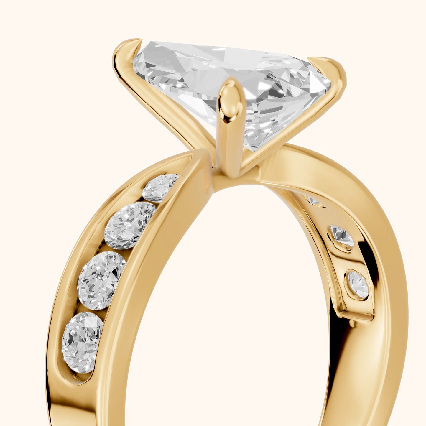 Noor Channel Set Sidestone Pear Diamond Engagement Ring in Yellow Gold - slant-view.webp