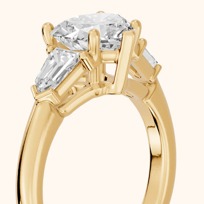 Dorothea Baguette Three-Stone Heart Diamond Engagement Ring in Yellow Gold - slant-view.webp