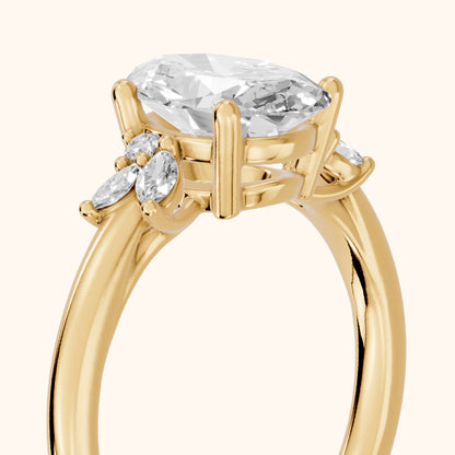 Avon Leaf Cluster Oval Diamond Engagement Ring in Yellow Gold - slant-view.webp