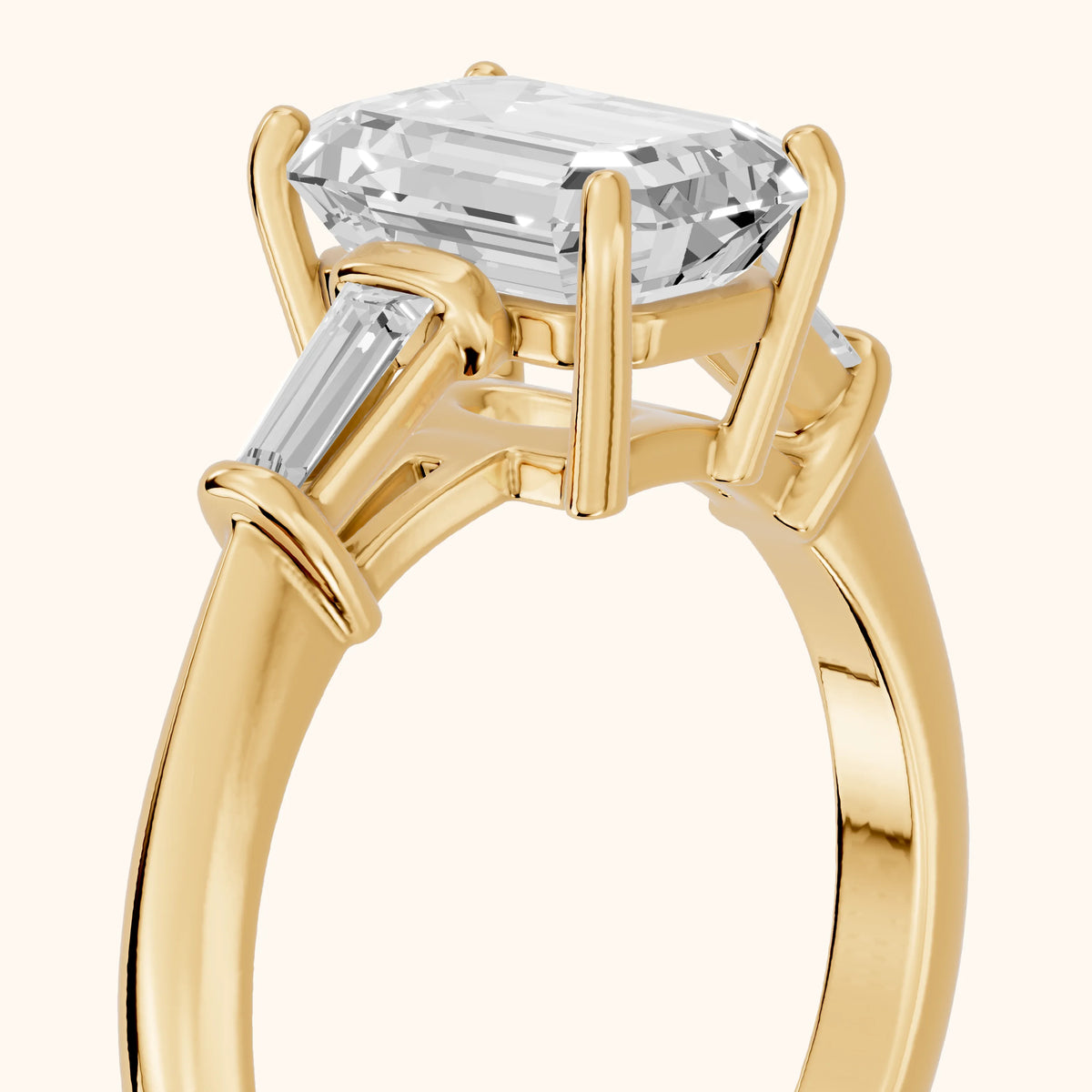 Abby Baguette Three-Stone Emerald Diamond Engagement Ring in Yellow Gold - slant-view.webp