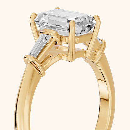 Abby Baguette Three-Stone Emerald Diamond Engagement Ring in Yellow Gold - slant-view.webp
