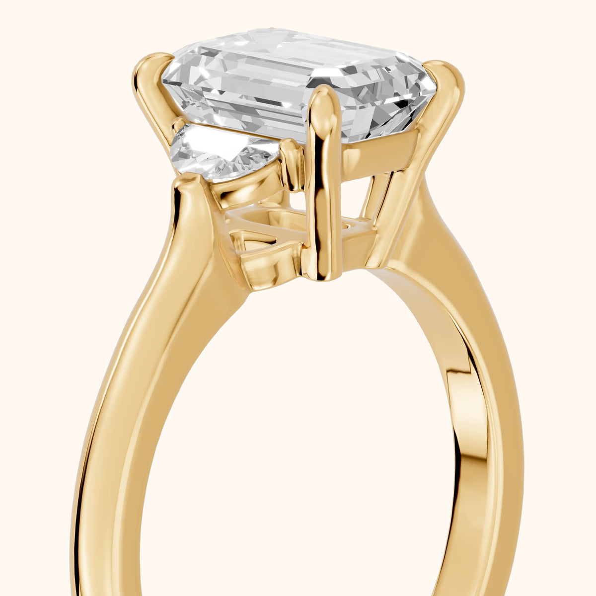 Hilary Half-Moon Three-Stone Emerald Diamond Engagement Ring in Yellow Gold - slant-view.webp