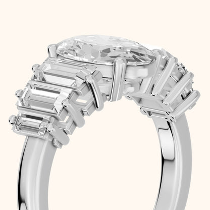 Mara Sidestone Baguette Accent Oval Diamond Engagement Ring in Platinum - slant-view.webp