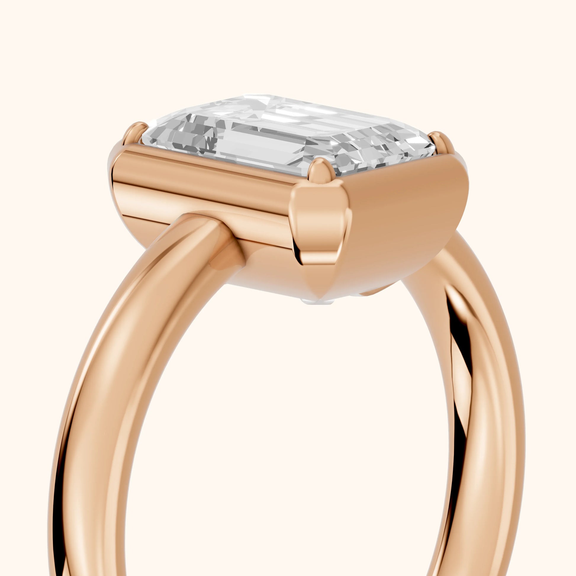 Alina Bezel Solitaire Emerald Diamond Ring in Rose Gold - slant-view.webp
