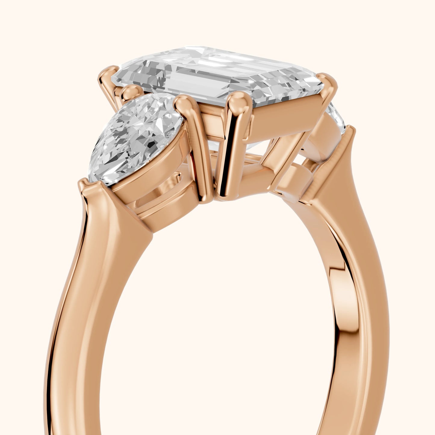 Mirabel Three-Stone Emerald Diamond Engagement Ring in Rose Gold - slant-view.webp