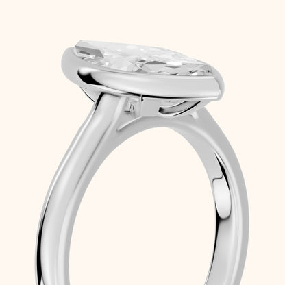 Jolie Bezel Solitaire Marquise Diamond Engagement Ring in Platinum - slant-view.webp