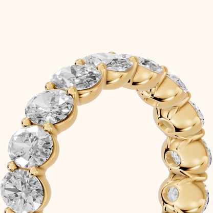 Neha Shared Prong Oval Diamond Eternity Band in Yellow Gold - slant-view